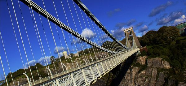 Suspension bridge against blue sky