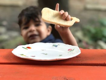 Close-up of boy eating food