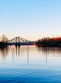 View of bridge over river against clear sky