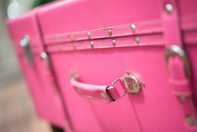 Close-up of pink suitcase