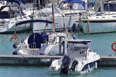Boats moored at harbor