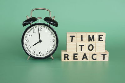 Close-up of clock on blue background