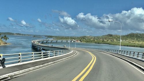 Panoramic view of bridge over road against sky
