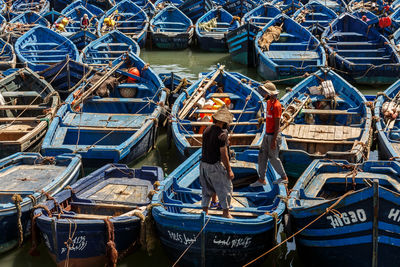 Boats moored at harbor