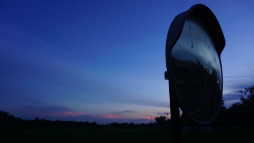 Close-up of silhouette plant on field against sky at sunset