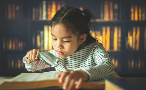 Portrait of a girl sitting on table