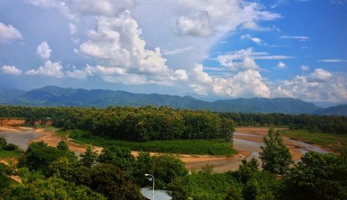 Scenic view of mountains against cloudy sky