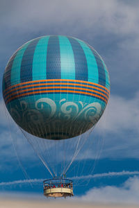 Low angle view of hot air balloon against blue sky