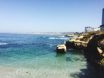 Scenic view of sea against clear blue sky