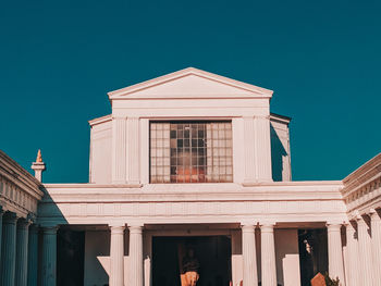 Low angle view of historical building against blue sky