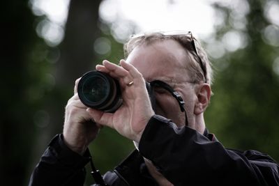 Close-up of man photographing