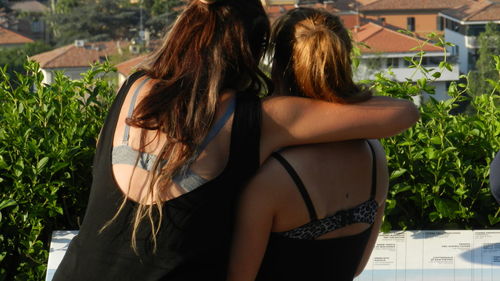 Rear view of woman standing outdoors