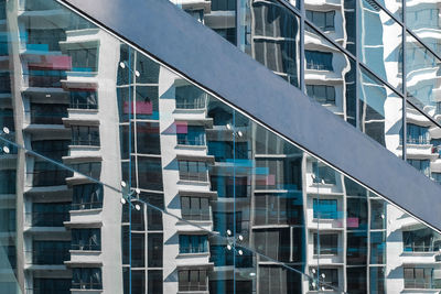 Glass reflection of modern building in city