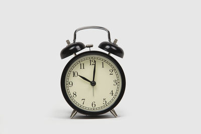 Close-up of clock against white background