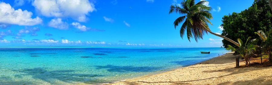 Panoramic view of sea against blue sky