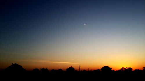 Scenic view of silhouette landscape against sky during sunset