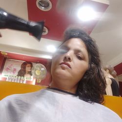 Portrait of young woman looking away at home