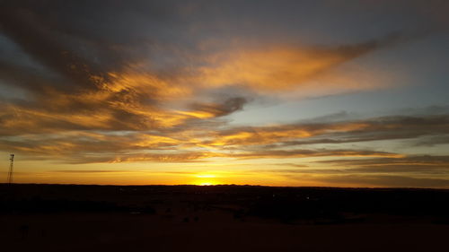 Scenic view of dramatic sky during sunset