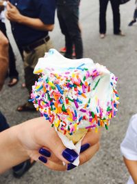 Low section of woman holding ice cream