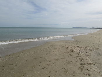 Scenic view of beach against sky