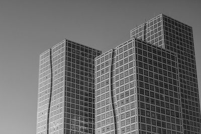 Low angle view of modern buildings against clear sky