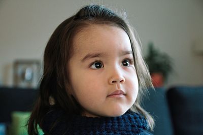 Close-up portrait of cute baby at home