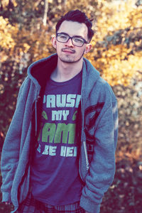 Portrait of young man standing outdoors