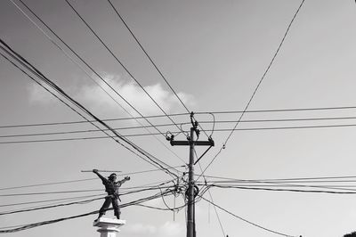 Low angle view of electricity pylon