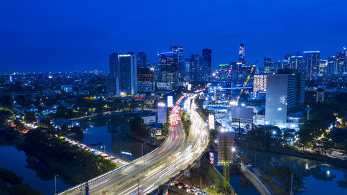 High angle view of illuminated cityscape at night