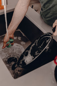 High angle view of man working in kitchen