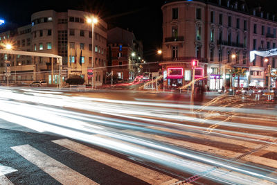 Light trails on road in city at night