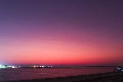 Scenic view of beach against sky at night