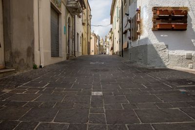 Narrow alley amidst buildings in town