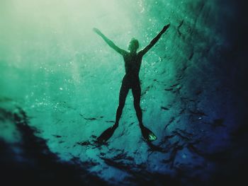 Woman jumping in water