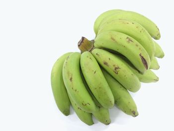 Close-up of fruit over white background