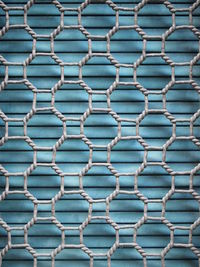 Full frame shot of metal grate against wall