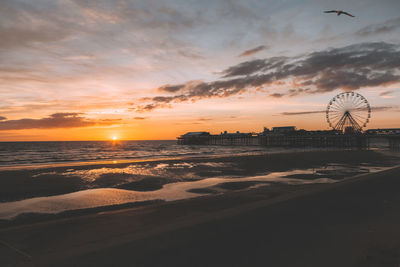 Scenic view of beach at sunset