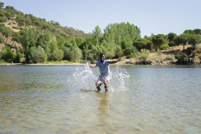 Young man enjoying a day in the river