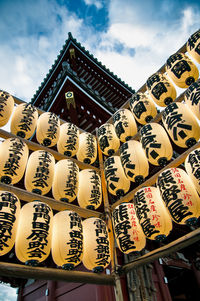 Low angle view of japanese lanterns hanging in asakusa kannon temple