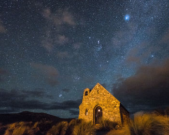 Low angle view of building against sky at night