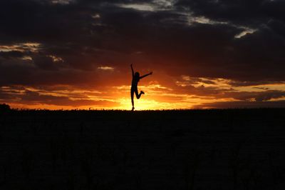 Silhouette of landscape against sunset sky