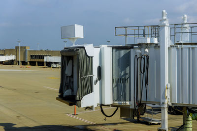 Metallic structure in airport against sky