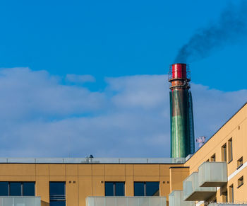 Low angle view of built structure against blue sky