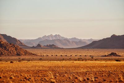 Scenic view of landscape and mountains against sky
