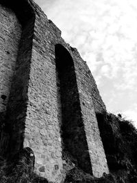 Low angle view of old ruin against sky