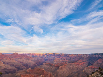 Scenic view of dramatic landscape against cloudy sky