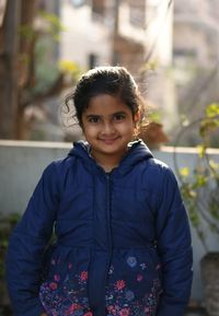 Portrait of smiling girl in winter jacket