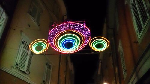 Low angle view of illuminated lights at night