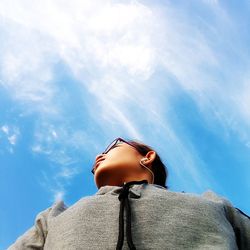 Low angle view of woman against sky