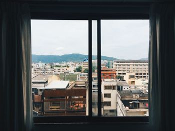 City seen through window at home